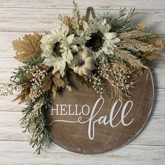 a sign that says hello fall with flowers on it