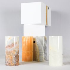 three different types of candles sitting next to each other