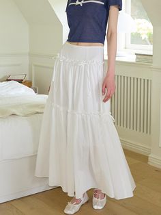 This is a trendy and feminine skirt by SALON DE YOHN that is made out of high quality and sturdy material. With distinctive mood of the design and modern feminine look, you can style it for your comfortable daily outfit.- Ribbon and shirring detail- Light fabric for spring and summer- Feminine and modern mood White High-waist Feminine Skirt, Feminine White Skirted Bottoms, White High Waist Feminine Skirt, White Lined Long Skirt, White Long Lined Skirt, Elegant Cotton Tiered Skirt, Feminine White Flowy Maxi Skirt, Elegant White Ruffled Maxi Skirt, Feminine Voluminous Long Skirt