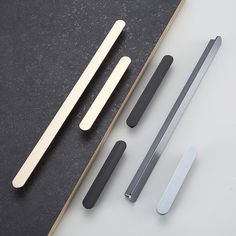 three different types of kitchen knives on a table