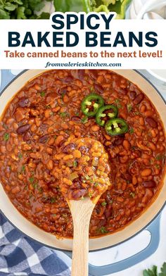 baked beans in a white bowl with a wooden spoon and text overlay that reads spicy baked beans take canned beans to the next level