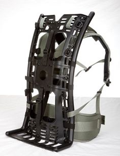 the back side of a backpack with straps and harnesses attached to it, on a white background