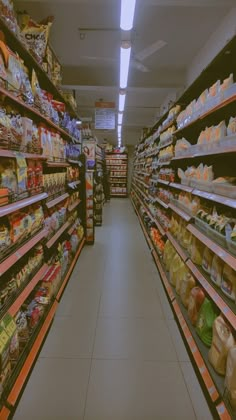 an aisle in a grocery store filled with lots of food