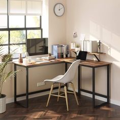 a corner desk with a chair and computer on it in front of a large window