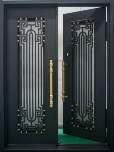 two black doors with gold handles and glass panels