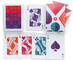 four playing cards with different patterns and colors on each card are arranged in the same pattern