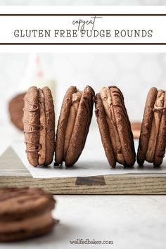 chocolate cookies are lined up on top of each other