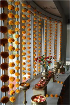 a long table with orange flowers on it