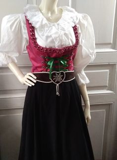 90s folk dress, traditional trachten dress, bavarian tyrolean floral jacquard dress, sleeveless dirndl dress, 40 size, peasant german dress.  white top and the belt are not included.  vintage items always show signs of being worn  please check the measureme nts before ordering  Measurements laying flat : shoulders :33 cm (13 inches)  armpit to armpit(bust) :43 cm (17inches)  waist :37cm (14,5 inches)  hips :free  total lenght :113 cm(44,5 inches) Panto Costumes, German Dress, Dress Traditional, Folk Dress, Dirndl Dress, Folk Dresses, Floral Jacquard, Jacquard Dress, Dress Sleeveless