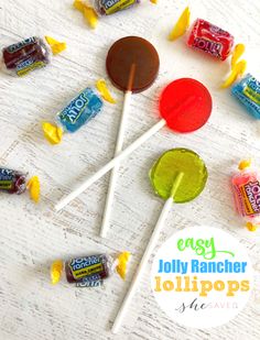 candy lollipops are arranged on a white table