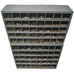 a large metal shelf filled with lots of screws