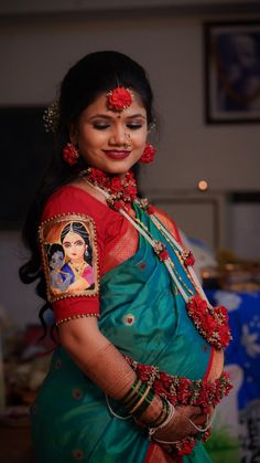 a woman in a green and red sari