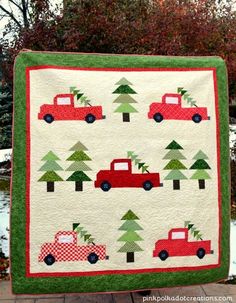 a quilted christmas tree and red truck with trees on it