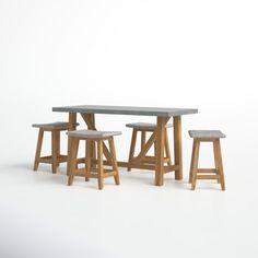 three stools and a table on a white background