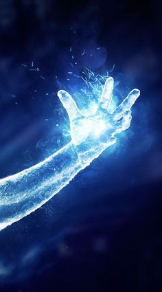 a hand holding something in the air with blue light coming from it's fingers