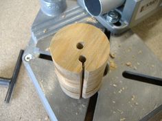 a machine that has some wood on it's side and is being used to make something