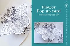 the paper is cut out to look like a flower with leaves and flowers on it