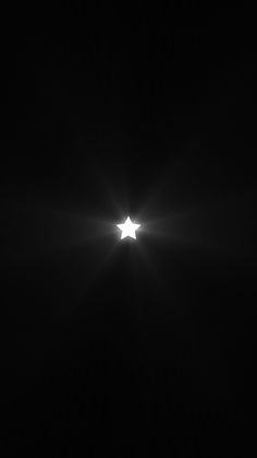 the sun is shining brightly in the dark sky, with only one light on it