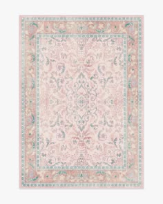 a pink rug with an ornate design on the bottom and blue trimmings, in front of a white background