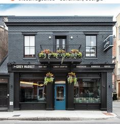 an image of a store front with flowers on the windows