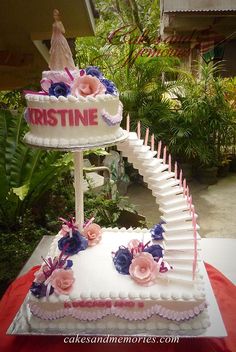 a wedding cake is decorated with flowers and candles for the bride to walk down the aisle