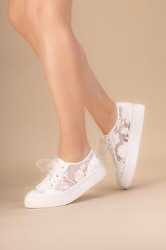 Meet Codie, where romance and elegance meets modern shape and comfort. Sheer floral lace overlaid onto lightweight ivory mesh lends a fairy tale vibe to this statement bridal trainer, whilst the clean silhouette platform sole keeps Codie super on trend. The oversized floral lace gives a distinctly designer vibe, showing up beautifully against the foot. Colour: Ivory Material: Lace, Satin Insole: Leather Heel Height: 2.5cm / 1" Shoe Style: Trainer Sizes: UK 3-10 (EU 36-43) Dyeable: Non Dyeable Silver Prom Jewelry, Prom Shoes Sparkly, Bridesmaids Jumpsuits, Wedding Shoes Vintage, Beautiful Wedding Shoes, Pretty Sneakers, Prom Necklaces