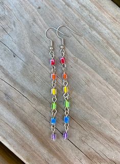 Silver Earrings With Colorful Beads, Multicolor Metal Dangle Crystal Earrings, Adjustable Silver Earrings With Colorful Beads, Rainbow Metal Earrings With Ear Wire, Rainbow Crystal Drop Earrings For Gift, Nickel-free Rainbow Round Beaded Earrings, Rainbow Nickel-free Earrings For Gifts, Nickel-free Rainbow Earrings For Gift, Nickel-free Rainbow Earrings Gift