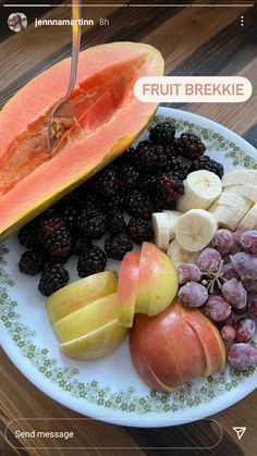 a plate filled with fruit on top of a wooden table