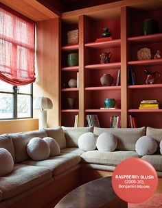 an instagram photo of a living room with bookshelves and shelves on the wall