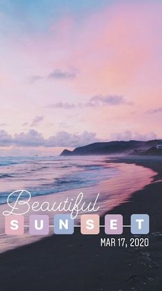 the beautiful sunset poster is displayed on a beach with waves crashing in front of it