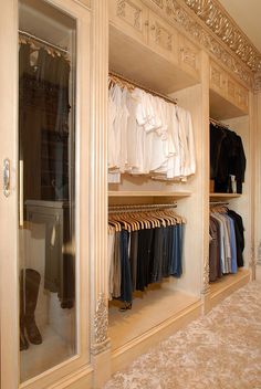 a walk in closet filled with lots of clothes