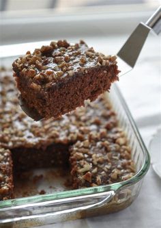 a piece of cake being lifted from a pan