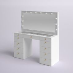 a white dressing table with lights on it