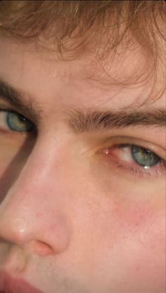 a close up of a person with blue eyes