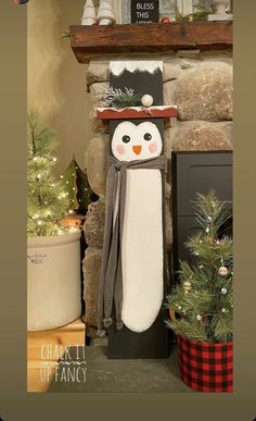 a snowman with a hat and scarf standing in front of a fireplace