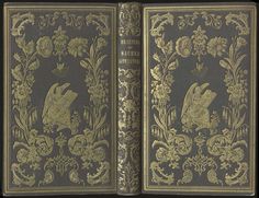 an old book with gold trimmings on the front and back cover, opened to reveal