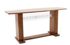 a wooden table with a sign that says no in remembrance of me on the side