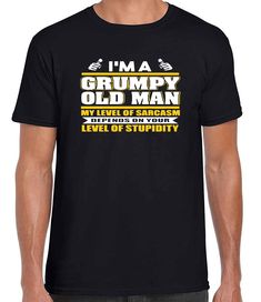 a man wearing a t - shirt that says i'm a grumpy old man