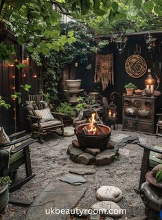 an outdoor fire pit in the middle of a garden with chairs and tables around it