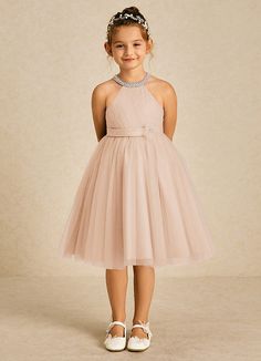 Honey is the perfect knee length dress for your sweet little girl. Cut from tulle, she features a pearl halter neckline, a pleated bodice, a scoop back, a ruched A-line skirt, and a beautiful beaded flower over her satin belt. Honey Flower, Satin Belt, Tulle Flower Girl, Flower Girl Dresses Tulle, English Rose, Pleated Bodice, Dress Flower, English Roses, Matte Satin