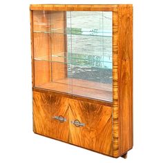 a wooden display case with glass doors on the front and bottom shelves, inlaid to wood