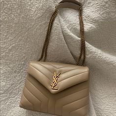 Ysl Lou Lou Size Small In The Color Dark Beige. Great Condition Smoke-Free Home! Never Really Used His Bag Always In Box. Comes With Box, Dust Bag And Receipt! Small Bag Outfit, Ysl Belt Bag, Ysl Kate Bag, Hobo Bag Outfit, Ysl Tote Bag, Bags Ysl, Saint Laurent Purse, Nude Bags, Coach Parker