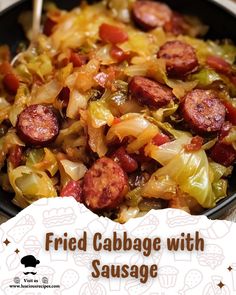 a bowl filled with cabbage and sausage on top of a table