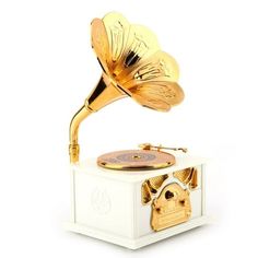 an old record player with a golden horn on it's head is shown in front of a white background