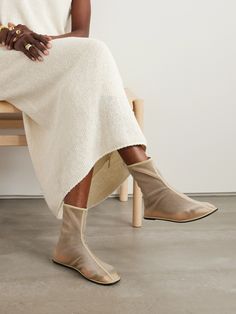 The Row's take on quiet elegance is at once contemporary and timeless. These playfully named 'Sock' boots have been crafted in Italy from barely-there mesh and set on comfortable leather soles. The understated design and minimal profile will work especially well with floaty skirts and dresses. Minimal Profile, Quiet Elegance, Simplicity Fashion, Mesh Socks, Flat Dress Shoes, Skirts And Dresses, Sock Boots, Dress Flats, Sport Swimwear