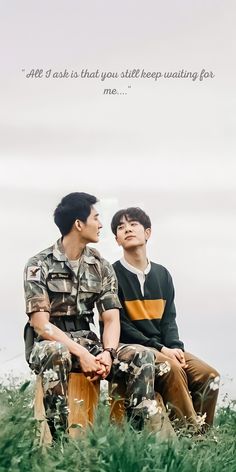 two young men sitting next to each other on top of a grass covered field with a quote above them