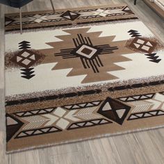 an area rug with brown and white designs on it