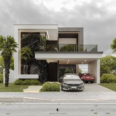 a car is parked in front of a modern house