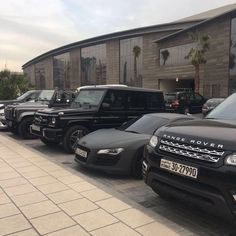 a row of cars parked next to each other in front of a building