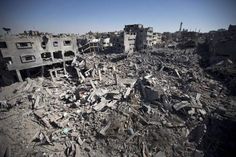 an aerial view of destroyed buildings in the middle of a city with lots of rubble